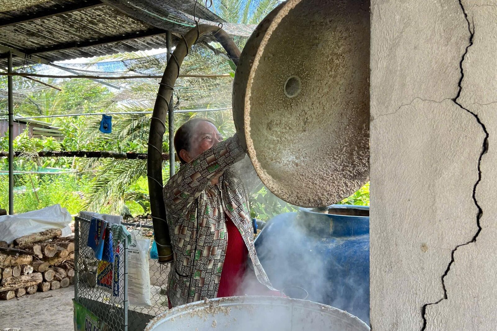 Cooking over a wood fire in the outdoor kitchen.