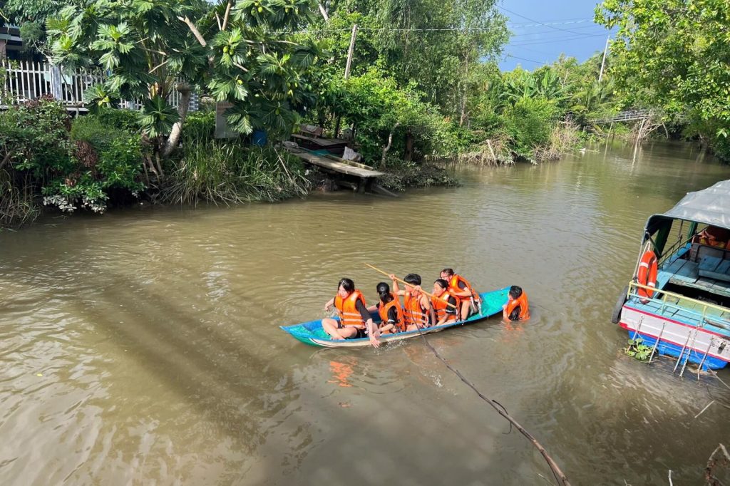 Kayaking in life jackets on the river.
