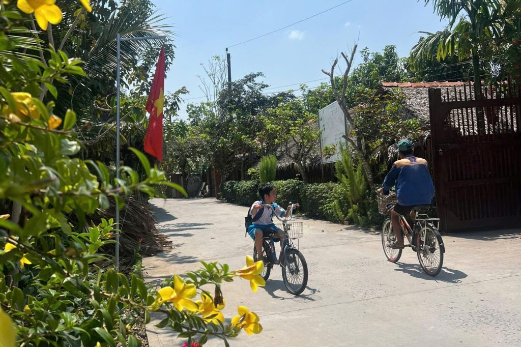 Cycling along the village road.