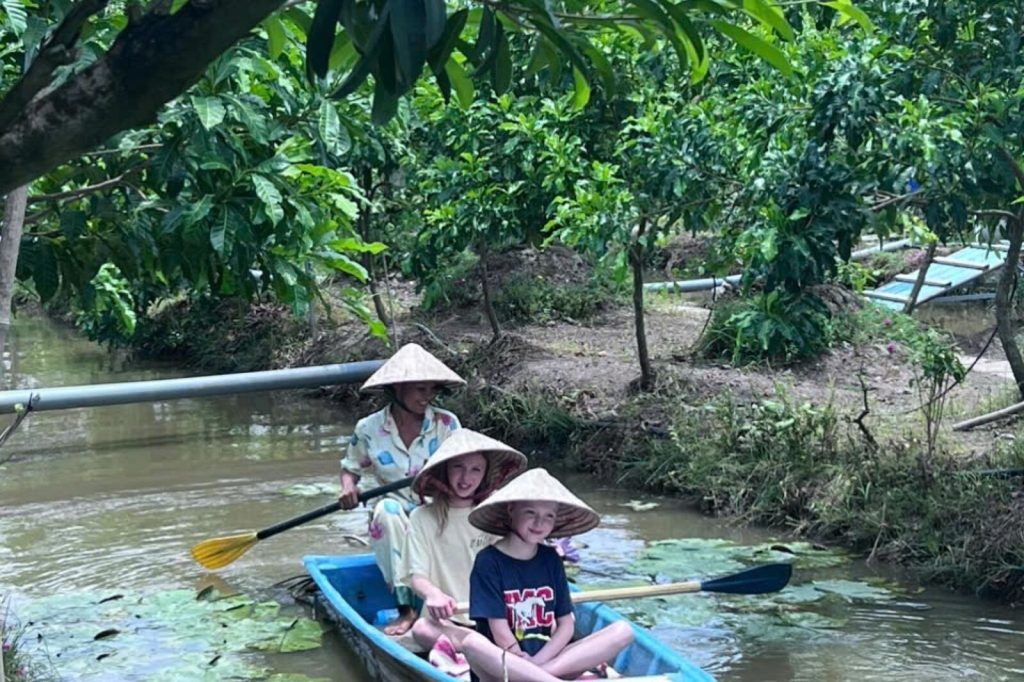 Paddling through the lotus leaves.