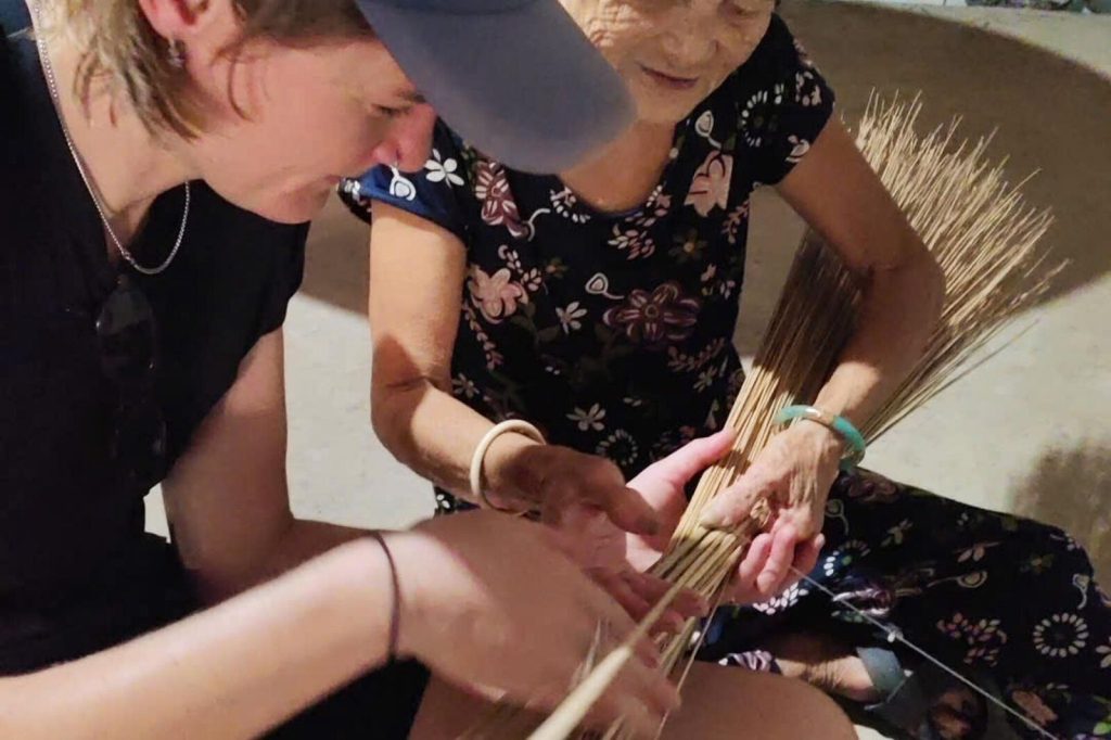 Hands-on broom weaving workshop.
