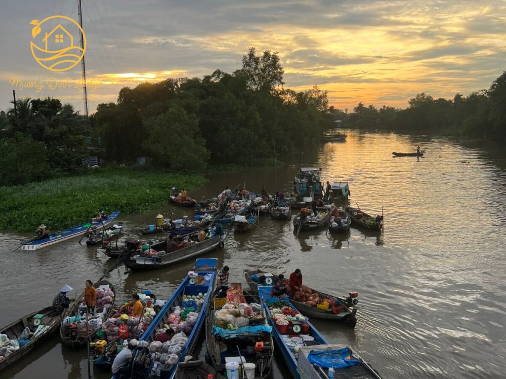 Small boats of a floating market gathered on a river under a golden sky.