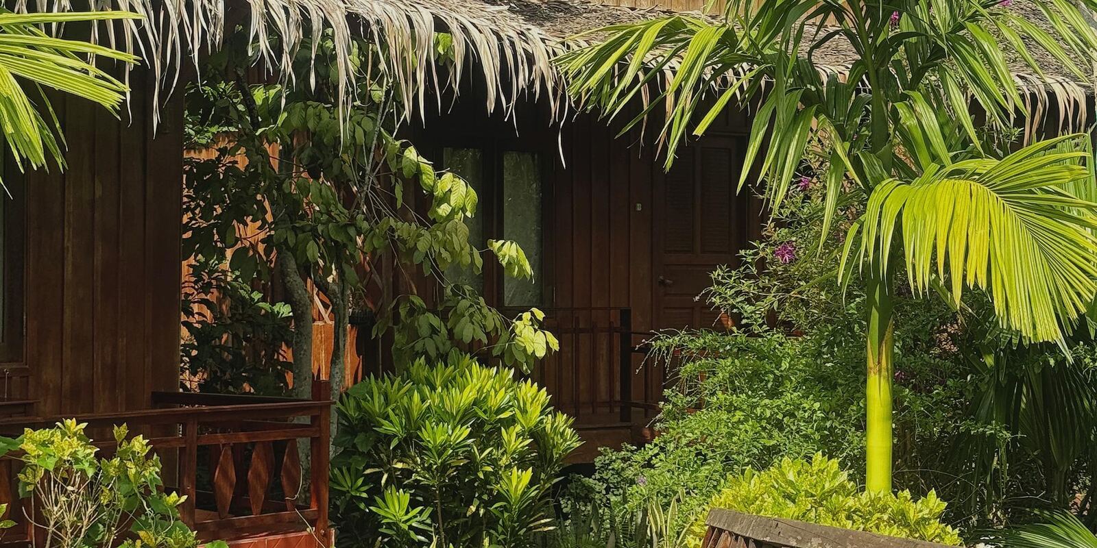 A bungalow veranda among the tropical plants.