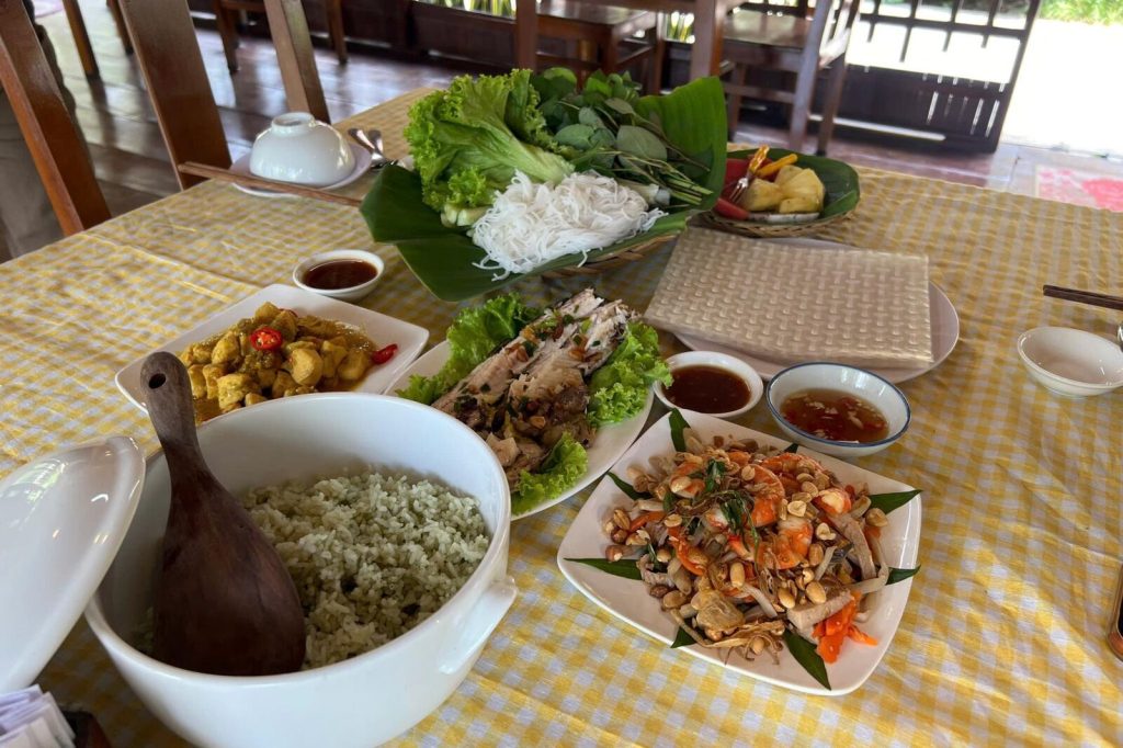 A family meal with spring rolls, herbs and stir-fries.