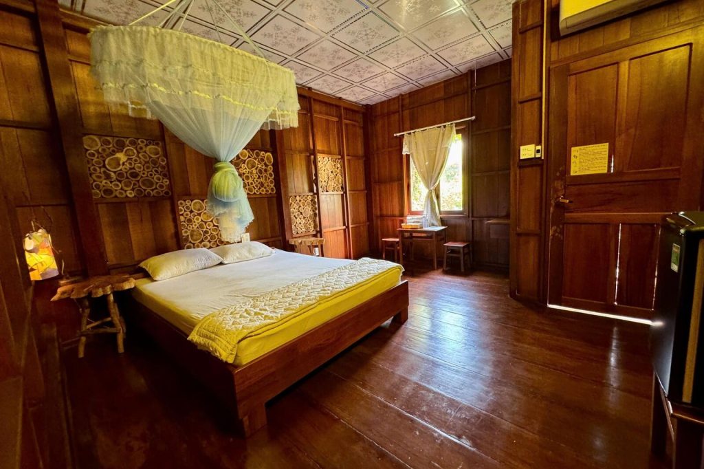 A double room in warm wood.